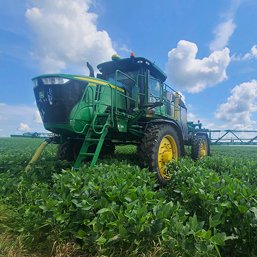 filling a sprayer with pesticide tank mix before application