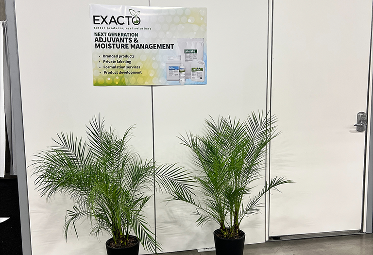 plants and innovative adjuvants and wetting agent technology sign at Exacto GCSAA meeting room